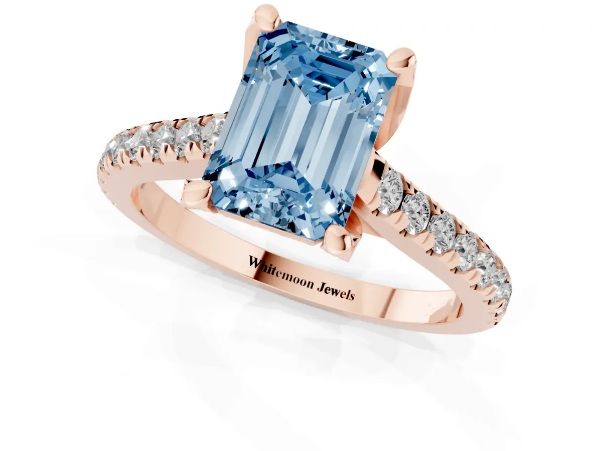 Fancy Blue Emerald Cut Brilliant Diamond Solitaire with Pavé Band and Four-Prong Setting Rose gold