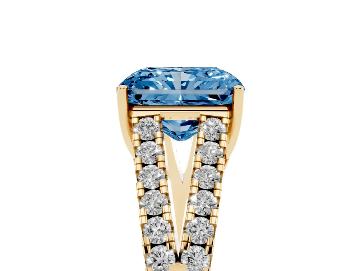 Fancy Blue Radiant Cut Diamond Split Shank Pavé Engagement Ring with Four-Prong Setting Yellow gold