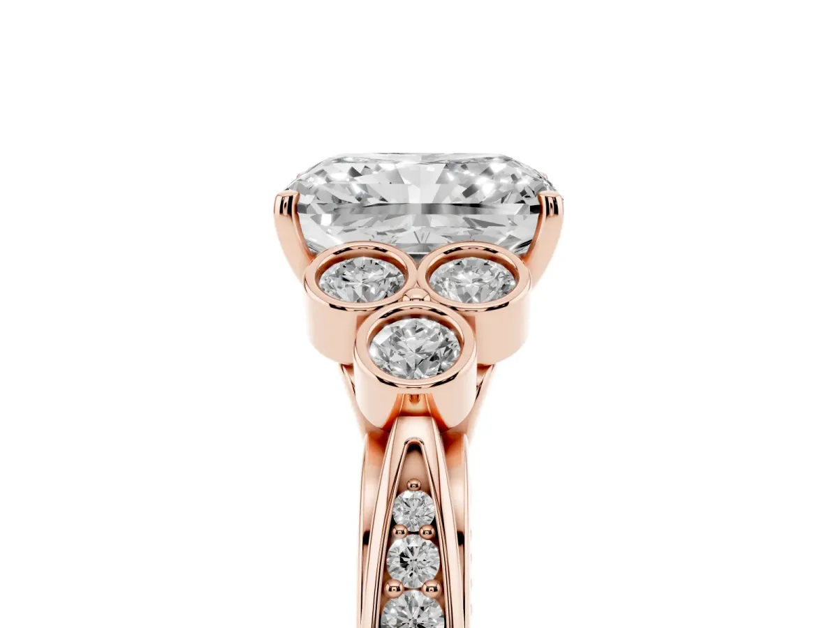 Radiant Cut Cut Diamond Engagement Ring with Bezel Set Round Side Stones and Prong Setting Rose gold