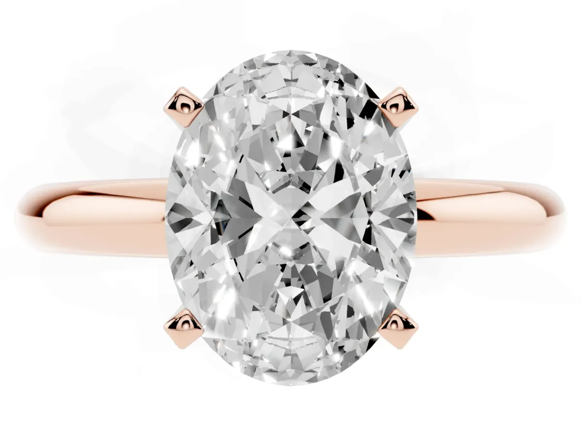 Oval Cut Diamond Solitaire Engagement Ring with Round Band and Four-Prong Setting Rose gold