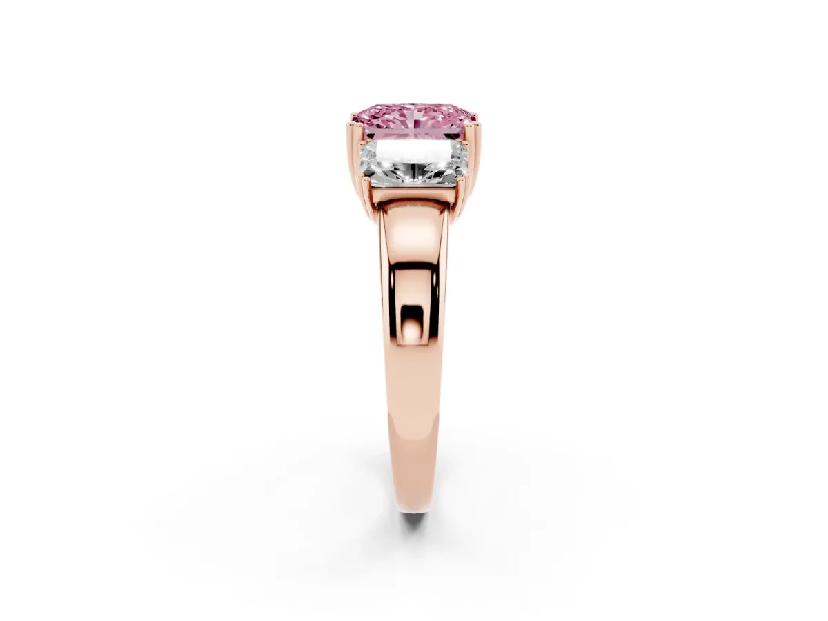 Fancy Pink Three-Stone Radiant Cut Cut Diamond Ring with Channel Set Band and Four-Prong Setting Rose gold