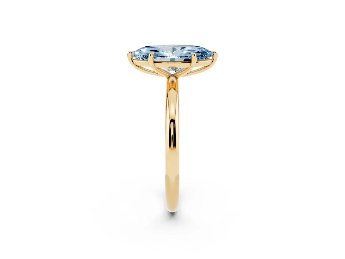 Fancy Blue Oval Cut Solitaire Diamond Ring with Four-Prong Setting on a Plain Band Yellow gold
