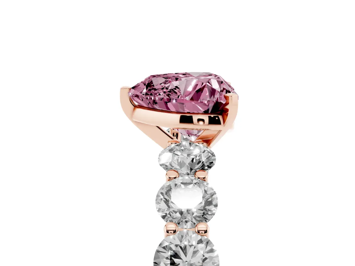 Fancy Pink Heart Cut Diamond Prong Setting with Side Stones on a Pave Band Rose gold