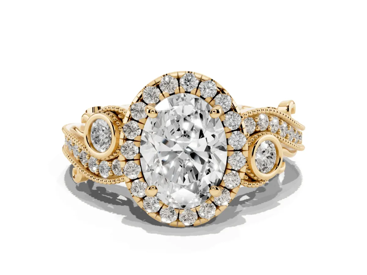 Oval Cut Halo Diamond Ring with Milgrain and Bezel Accents on a Split Shank Band Yellow gold