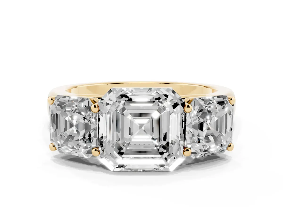 Asscher Cut Three-Stone Diamond Ring with Prong Setting on a Classic Band Yellow gold