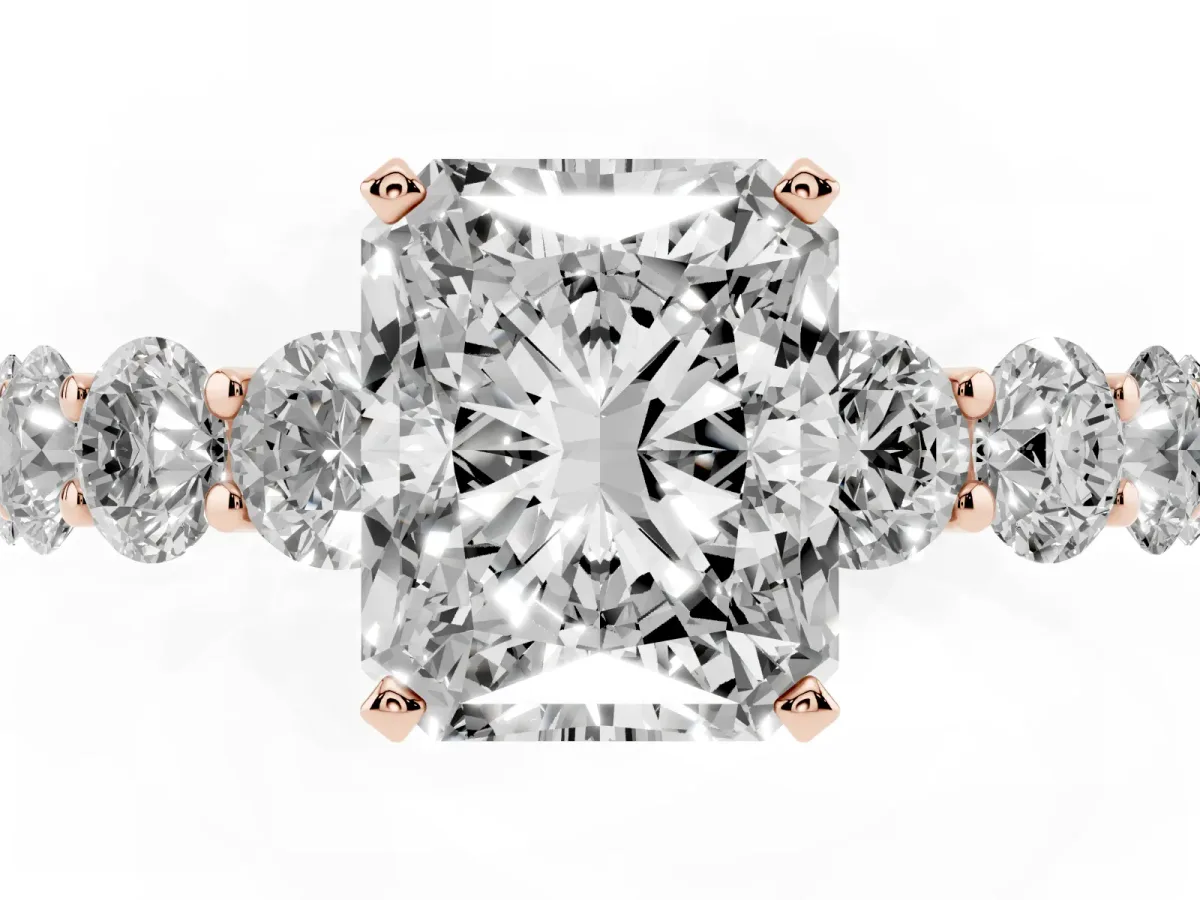 Radiant Cut Diamond Prong Setting with Side Stones on a Pave Band Rose gold
