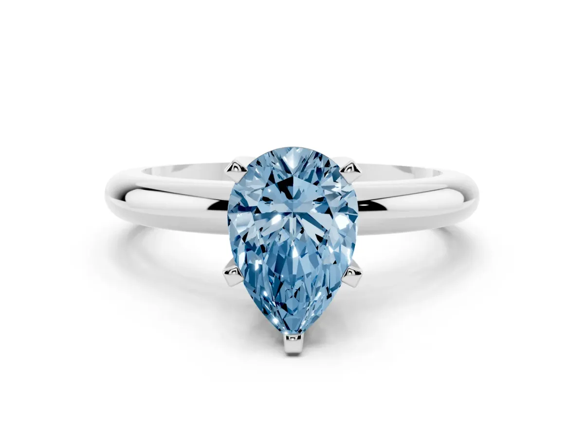 Fancy Blue Pear Cut Diamond Solitaire Engagement Ring with Round Band and Four-Prong Setting Silver
