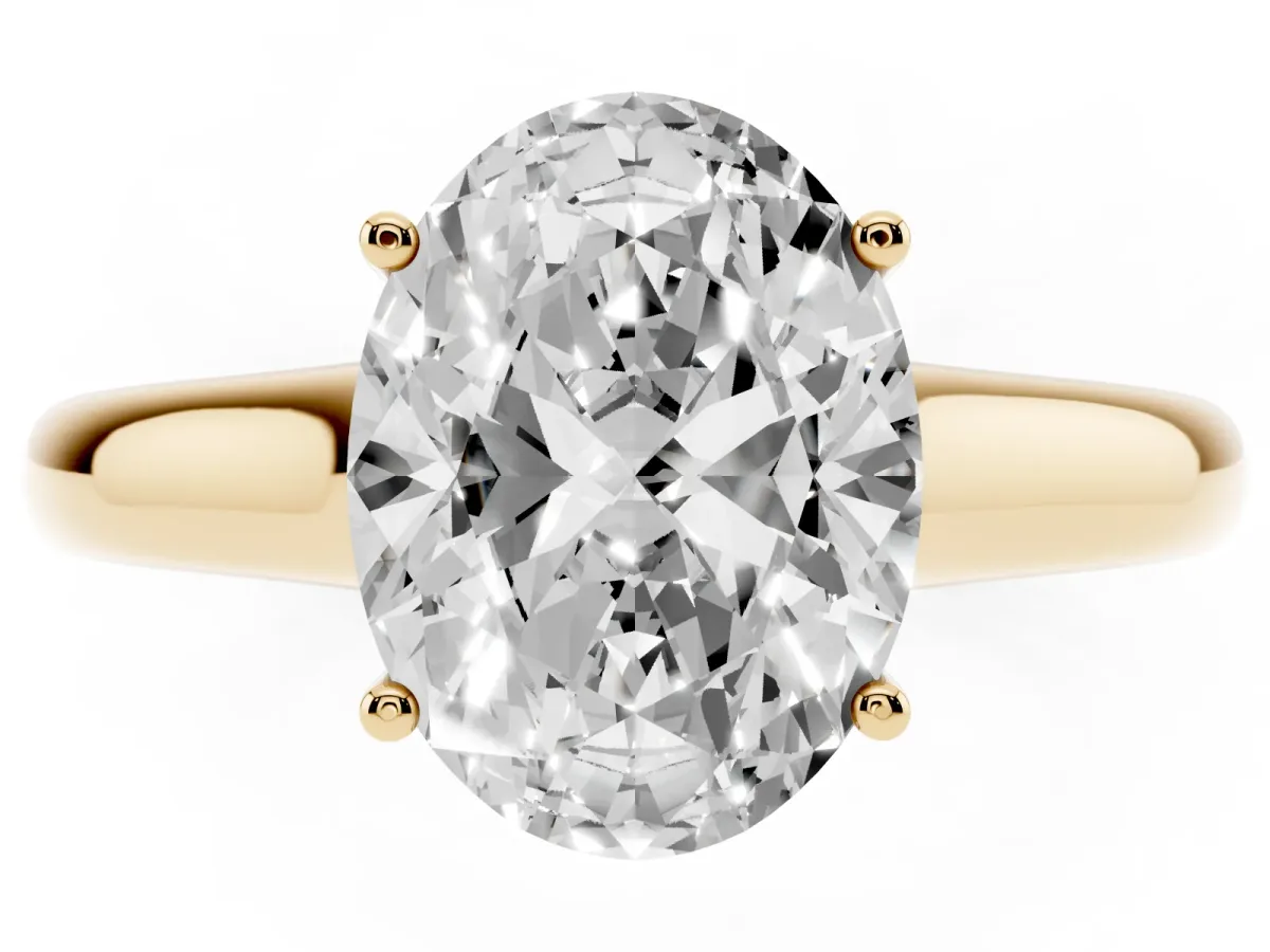 Oval Cut Solitaire Engagement Ring with Tapered Band and Four-Prong Setting Yellow gold