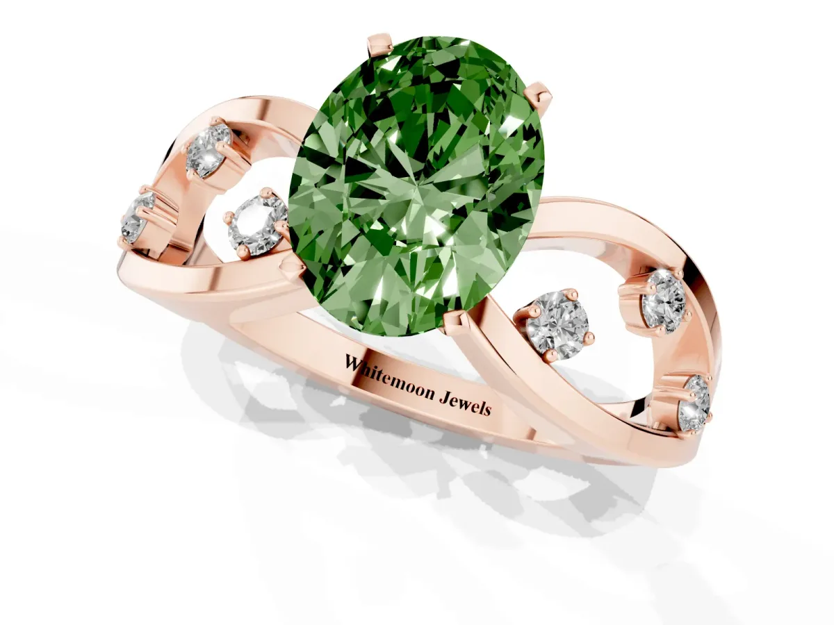 Fancy Green Oval Cut Cut Solitaire Diamond with Side Stones on Criss-Cross Band and Four-Prong Setting Rose gold