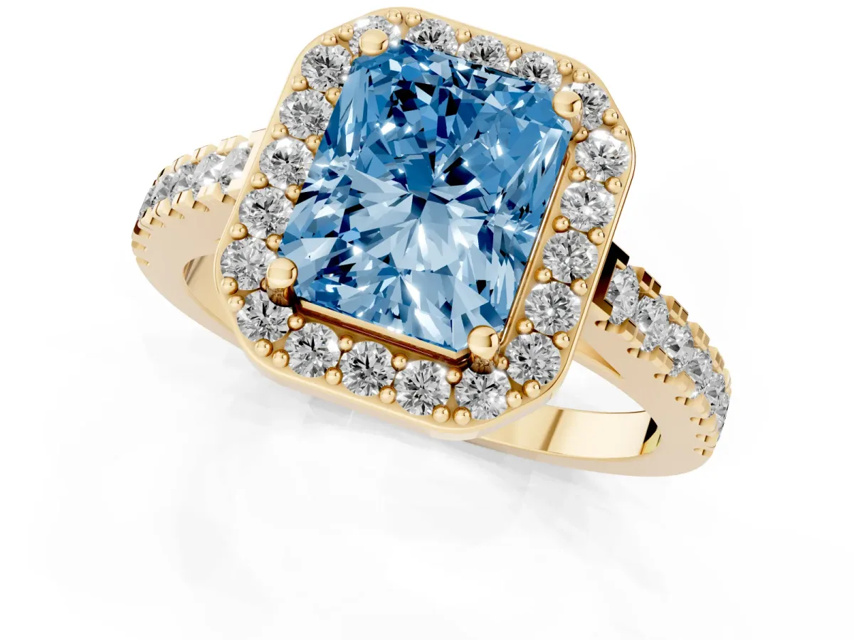 Fancy Blue Radiant Cut Diamond Halo Ring with Round Pavé Split Shank and Prong Setting Yellow gold