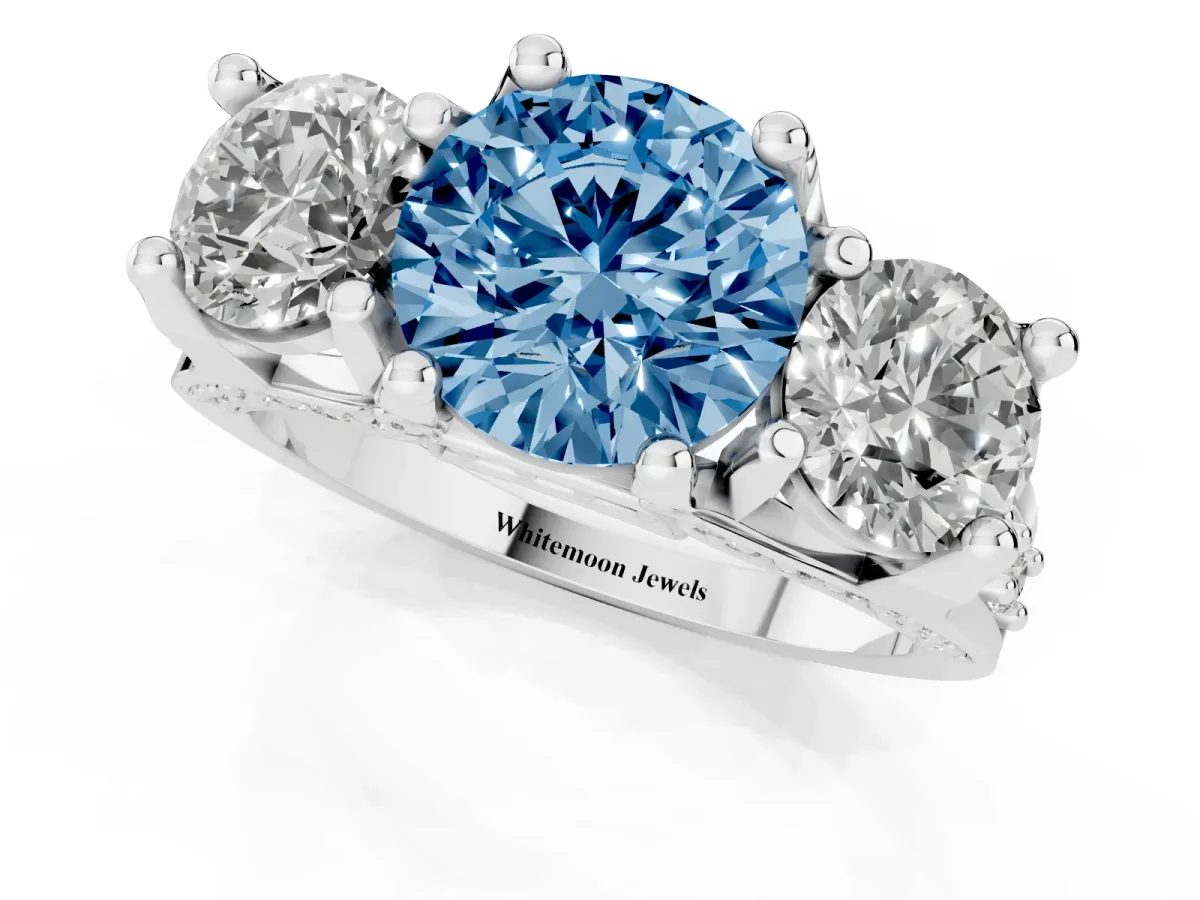 Fancy Blue Round Cut Diamond Three-Stone Ring with Channel Set Band and Four-Prong Setting Silver