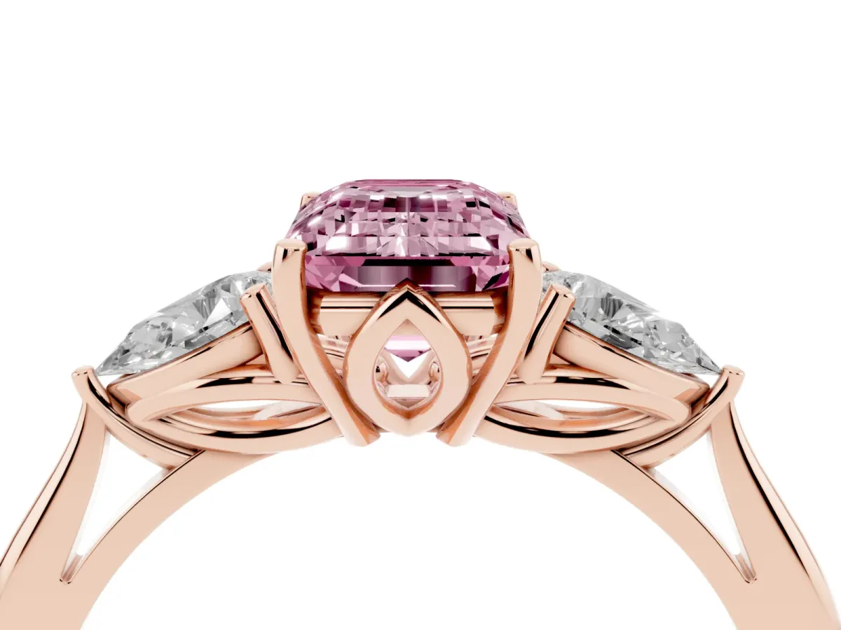 Fancy Pink Three-Stone Emerald Cut Diamond Ring with Pear Side Stones in Four-Prong Setting Rose gold