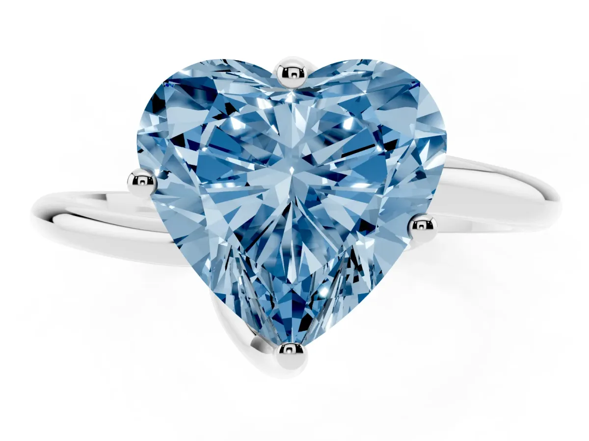 Fancy Blue Heart Cut Diamond Solitaire Engagement Ring with Four-Prong Setting and Classic Band Silver