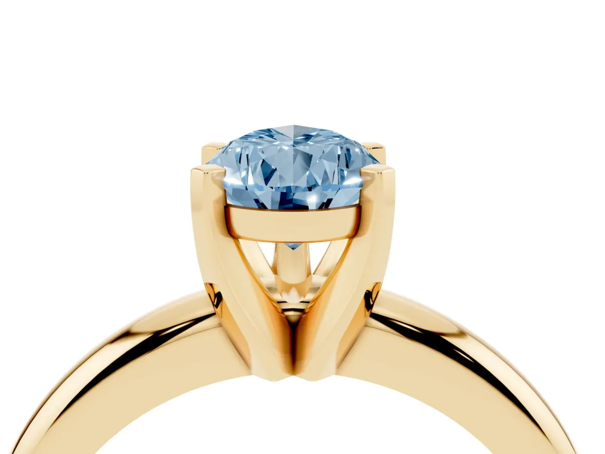 Fancy Blue Pear Cut Diamond Solitaire Engagement Ring with Round Band and Four-Prong Setting Yellow gold