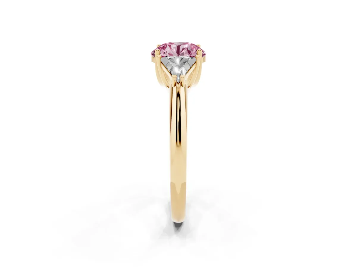 Fancy Pink Three-Stone Round Cut Diamond Engagement Ring with Trillion Side Stones and Prong Setting Yellow gold