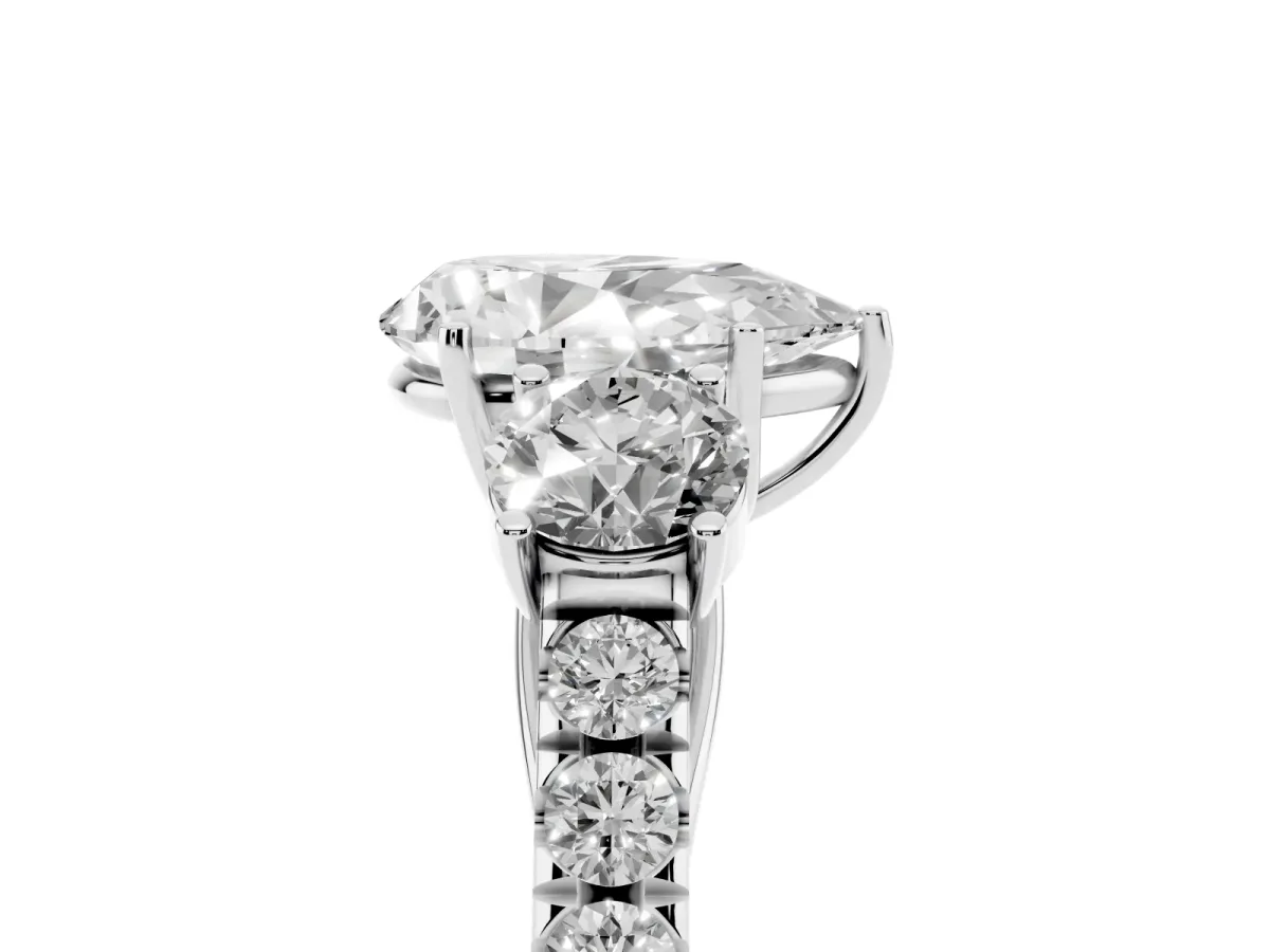 Pear Cut Cut Diamond Three-Stone Ring with Round Side Stones and Pavé Band Silver