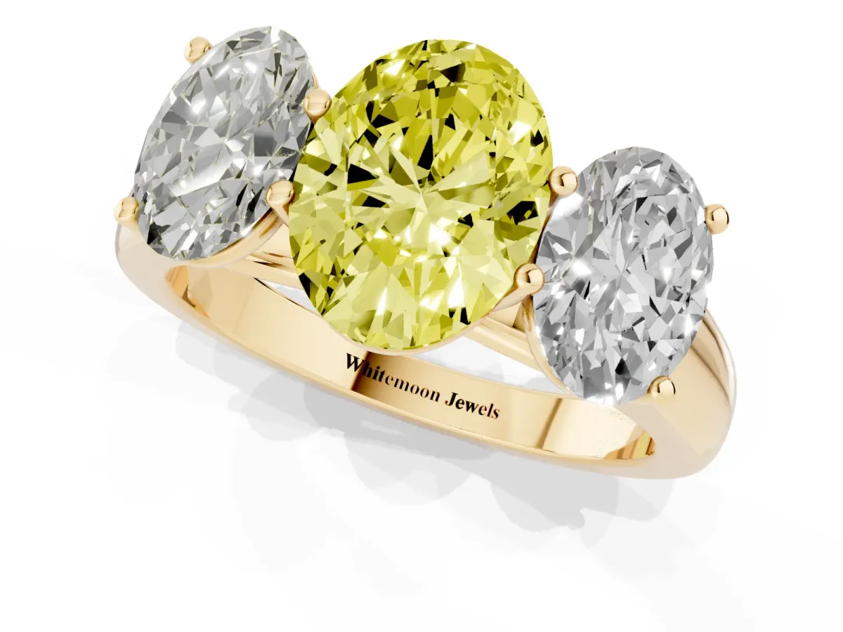 Fancy Yellow Oval Cut Three-Stone Diamond Ring with Prong Setting on a Classic Band Yellow gold