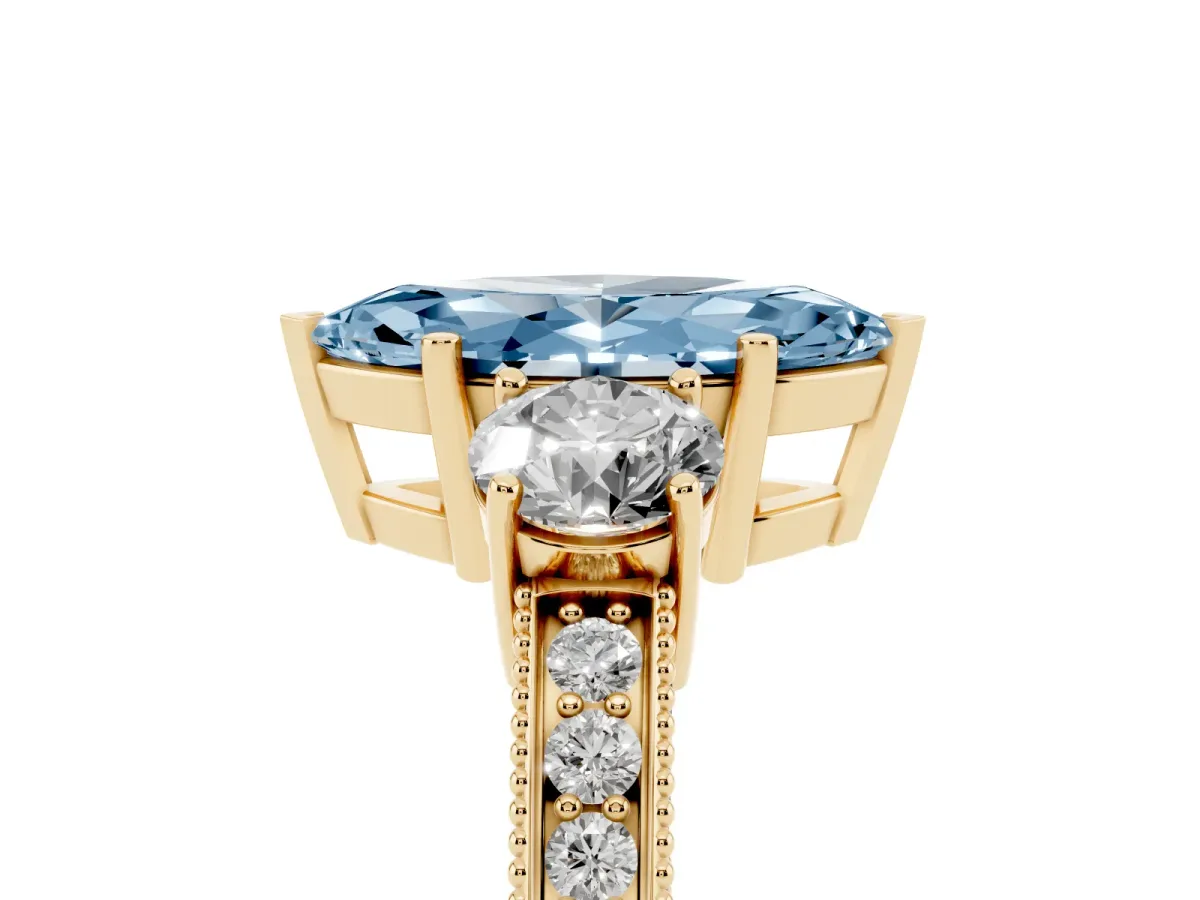 Fancy Blue Marquise Cut Three-Stone Diamond Ring with Pavé Band and Four-Prong Setting Yellow gold