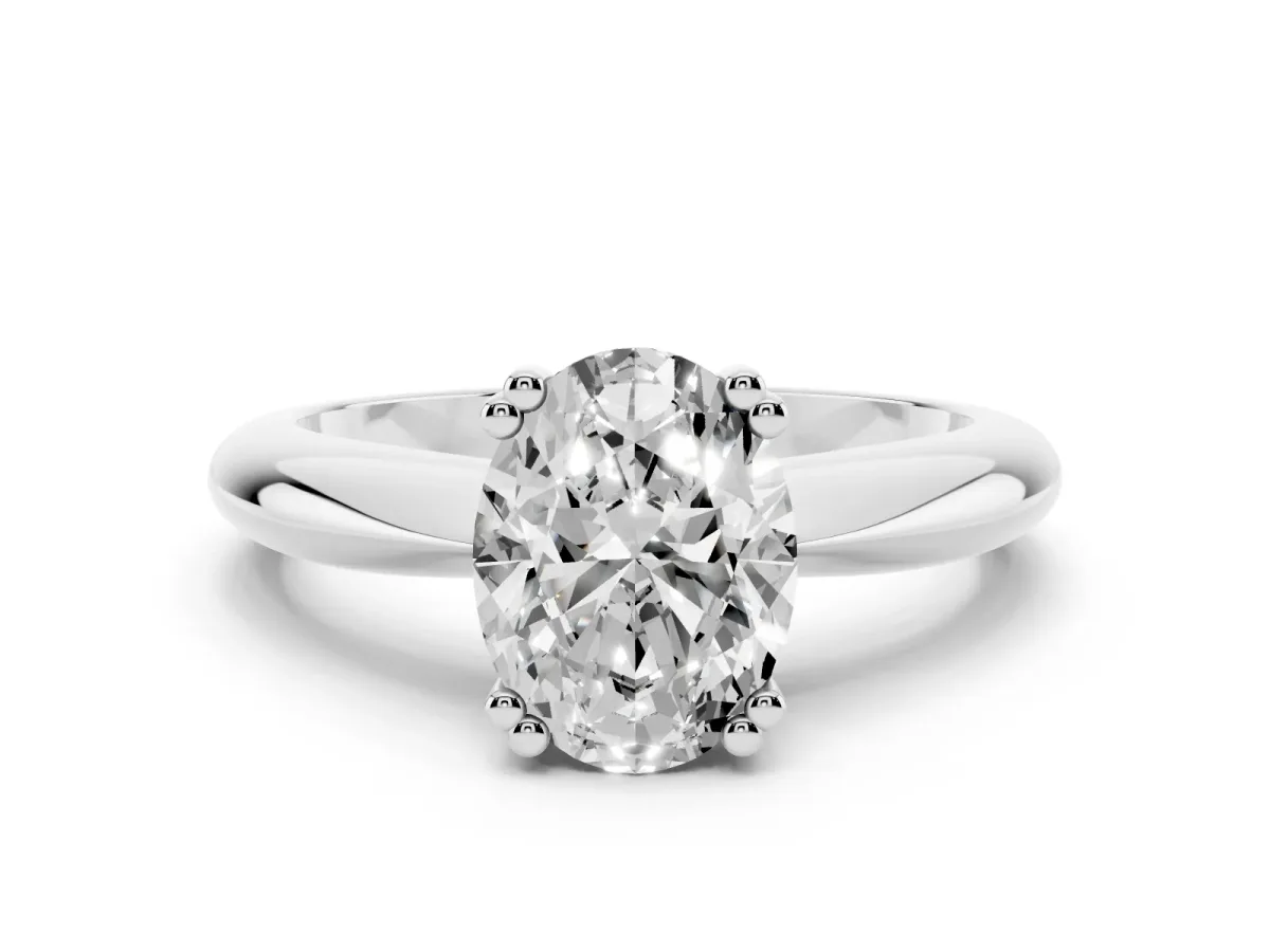 Oval Cut Cut Solitaire Engagement Ring with Tapered Band and Four-Prong Setting Silver