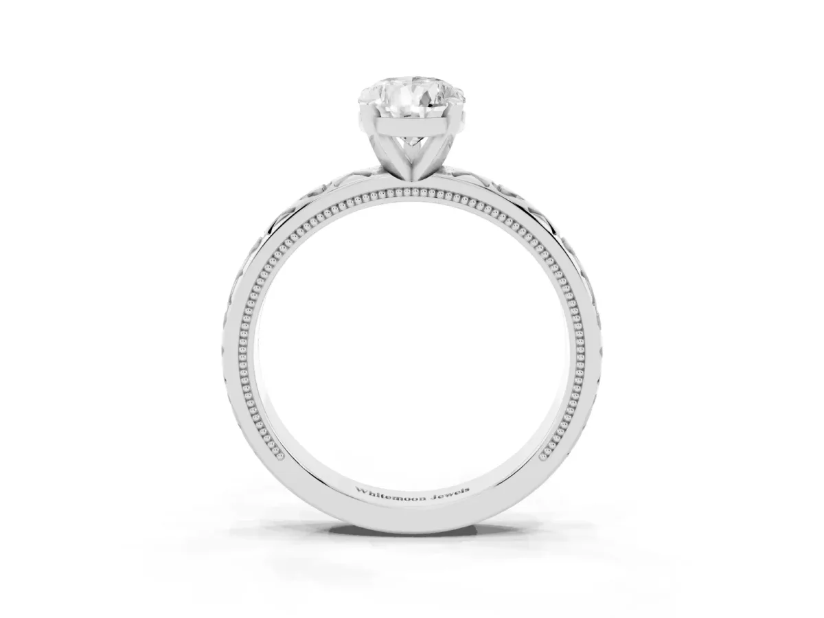 Pear Cut Solitaire Diamond Engagement Ring with XO Engraved Band and Four-Prong Setting White gold