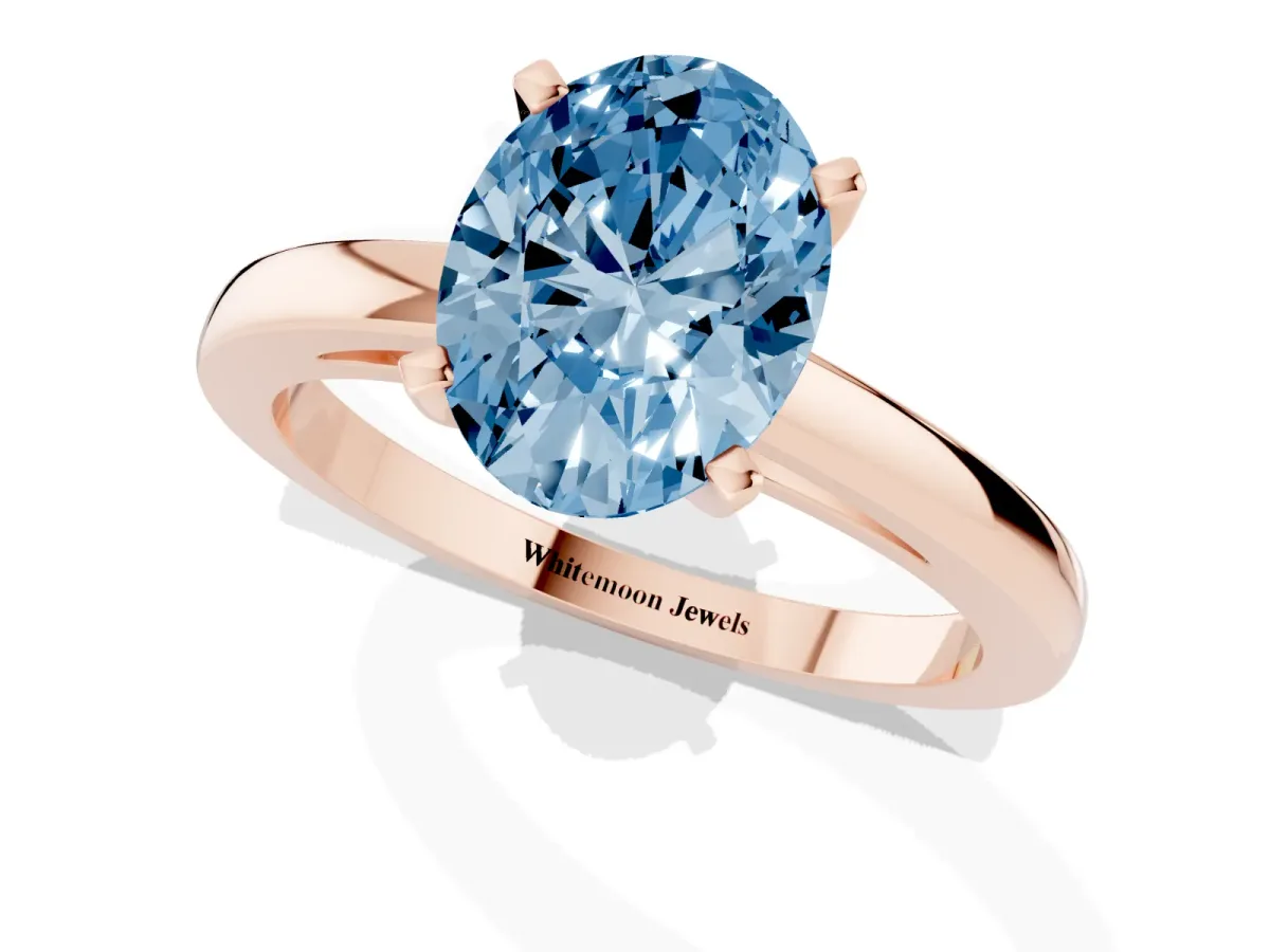 Fancy Blue Oval Cut Solitaire Diamond Engagement Ring with Four-Prong Setting on a Classic Band Rose gold
