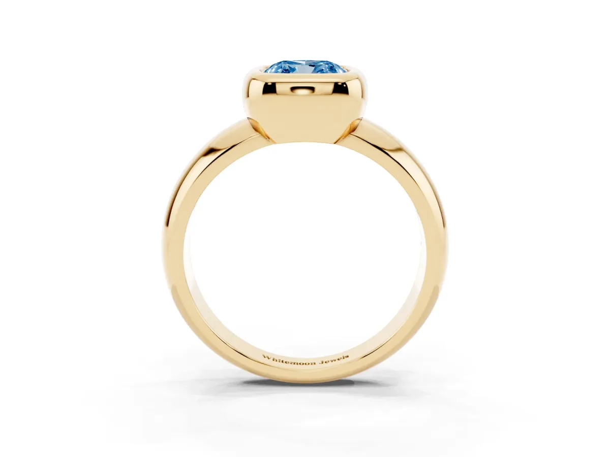 Fancy Blue Bezel Set Cushion Cut Solitaire Ring with Wide Band Yellow gold