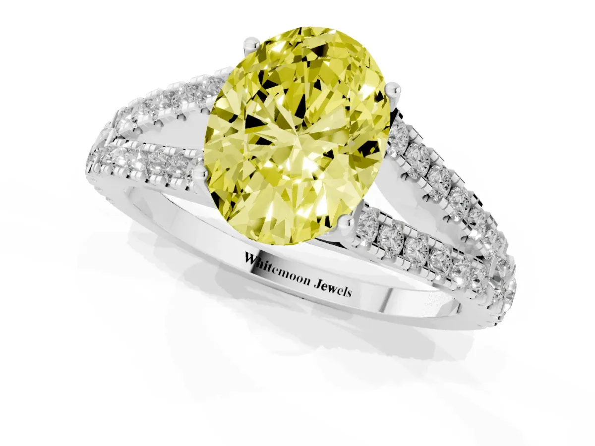 Fancy Yellow Oval Cut Diamond Split Shank Engagement Ring with Round Pavé and Prong Setting Platinum