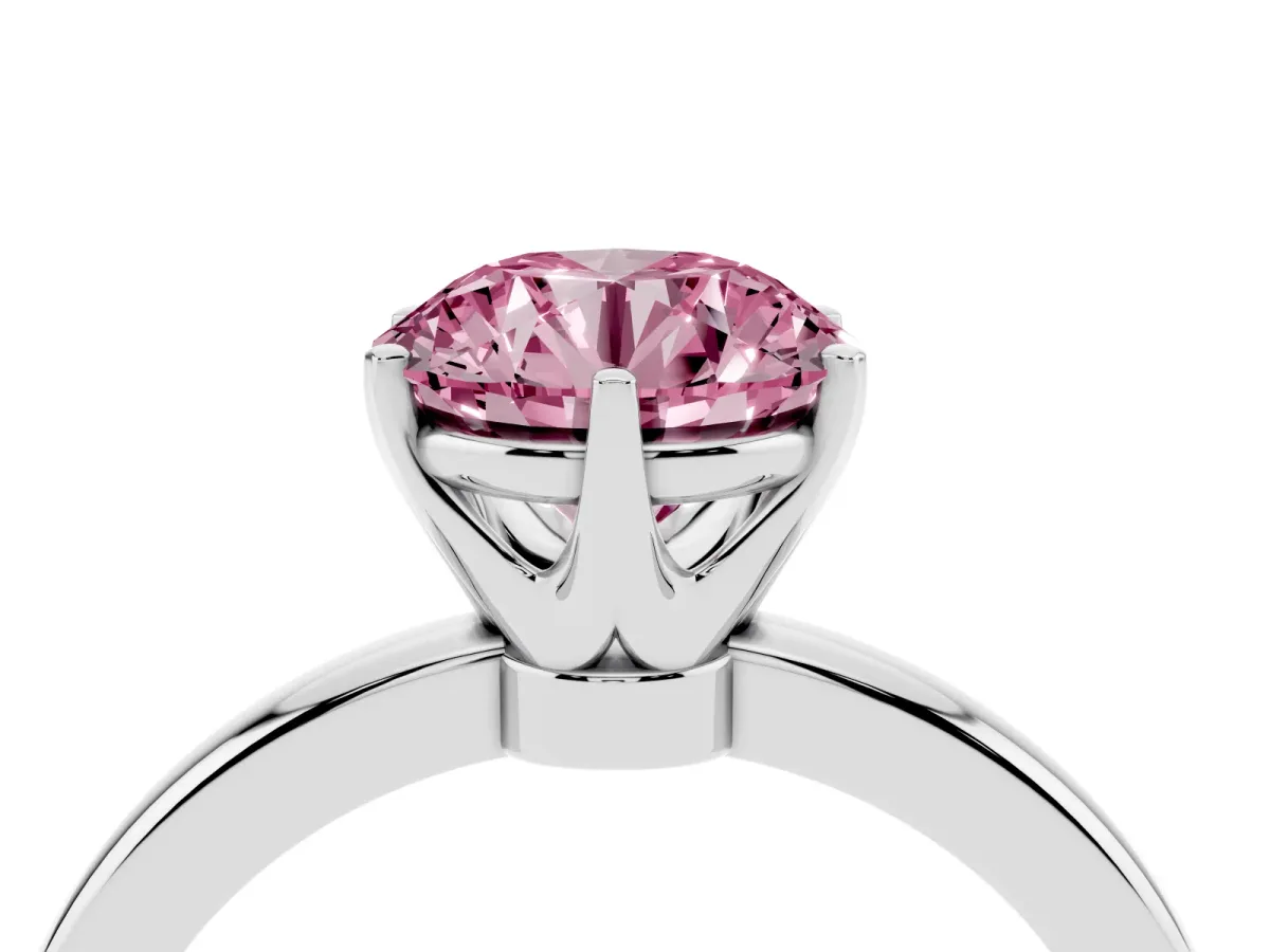Fancy Pink Round Cut Solitaire Diamond Ring with Six-Prong Setting on a Classic Band Platinum
