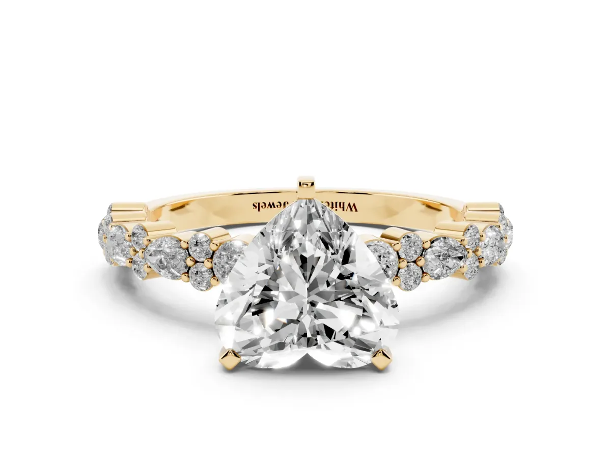Heart Cut Diamond Side Stone Solitaire Ring with Round and Four-Prong Setting Yellow gold