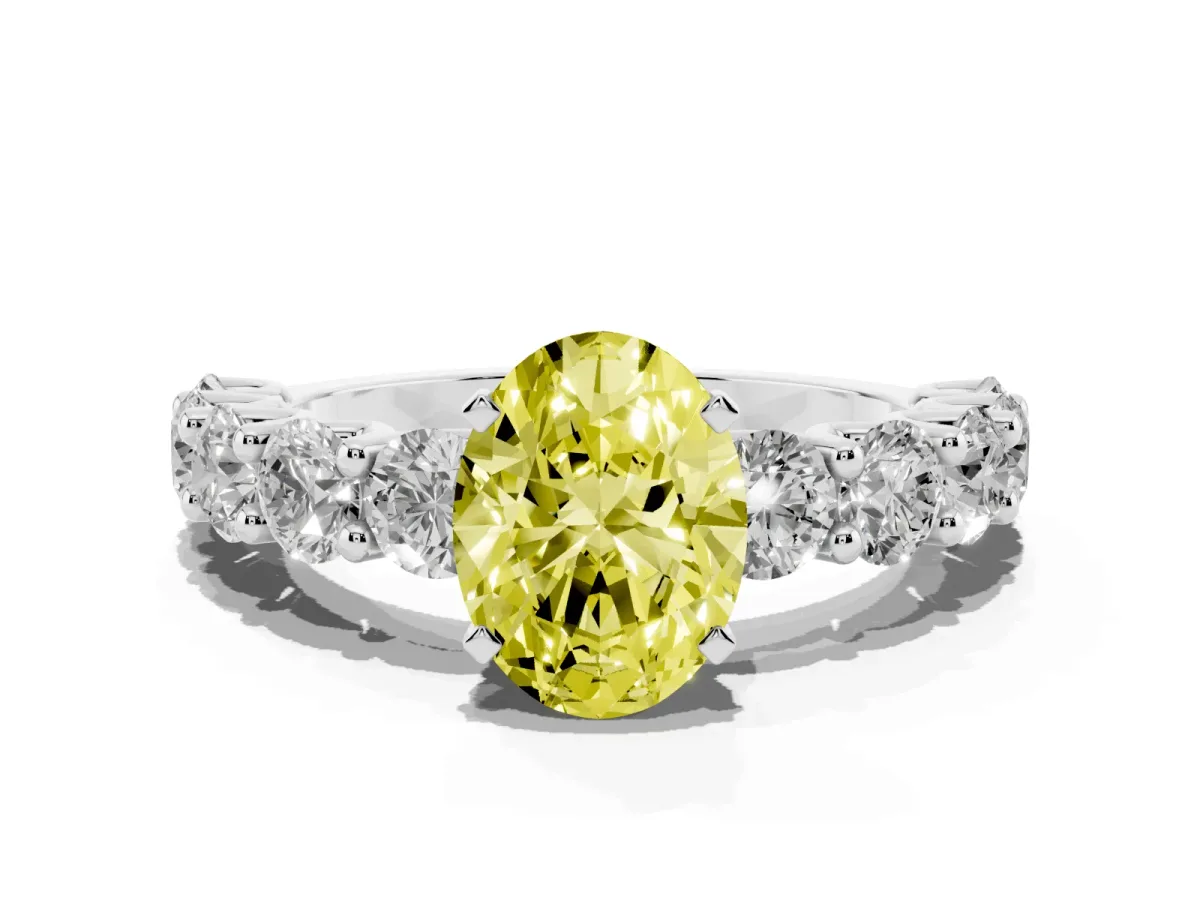 Fancy Yellow Oval Cut Diamond Prong Setting with Side Stones on a Pave Band Silver