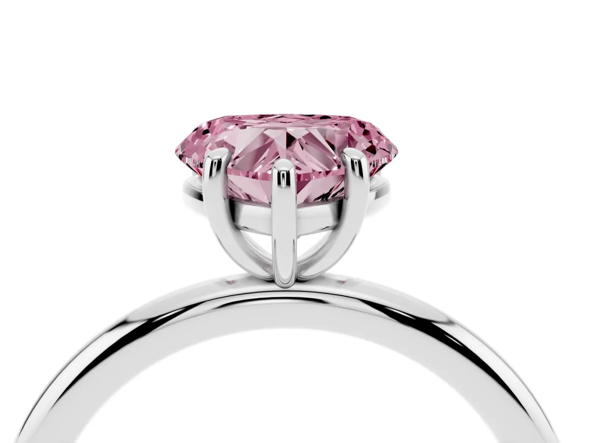 Fancy Pink Heart Cut Solitaire Diamond Ring with Four-Prong Setting on a Plain Band Platinum