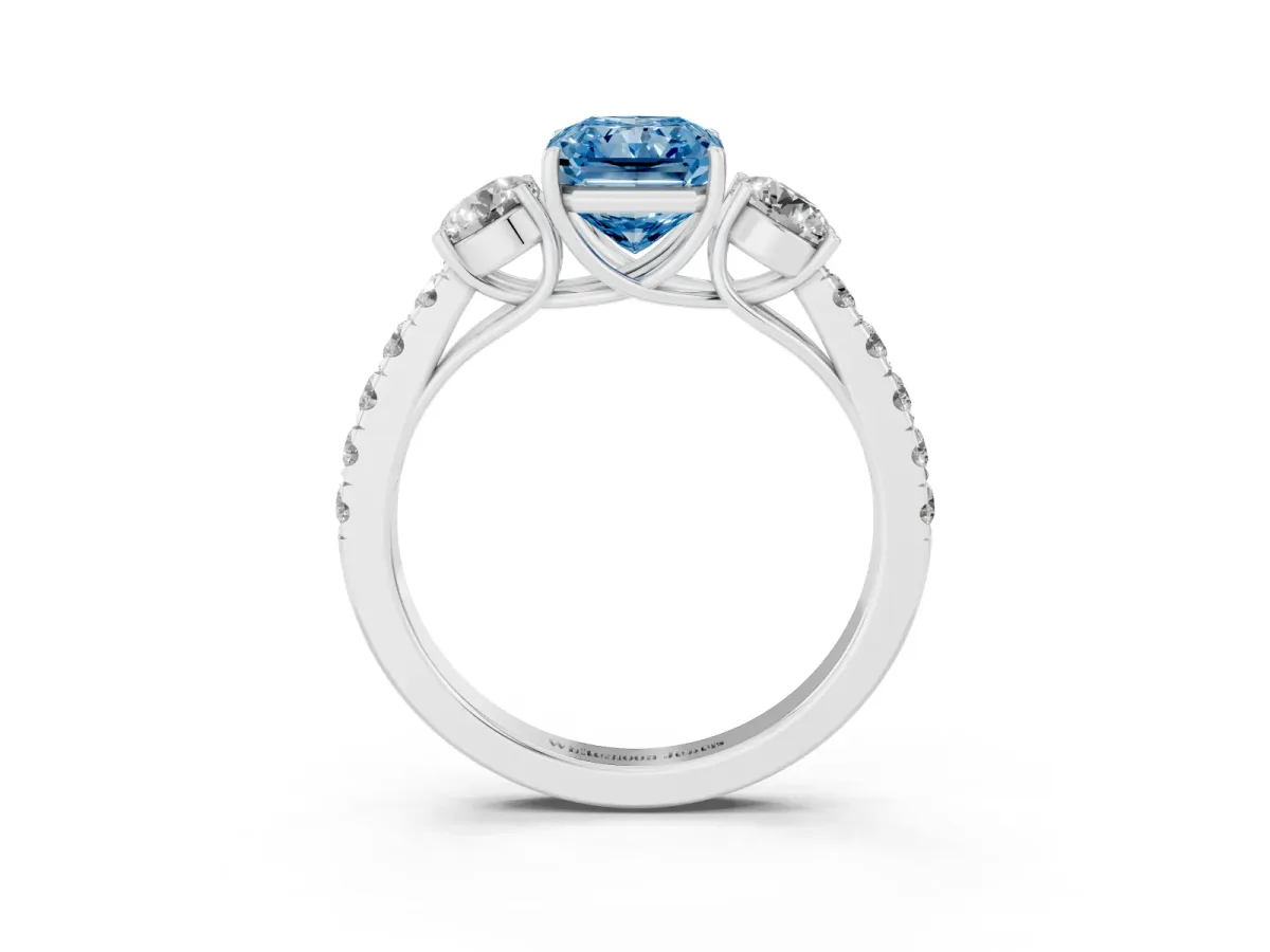 Fancy Blue Radiant Cut Cut Diamond Three-Stone Ring with Round Side Stones and Pavé Band White gold