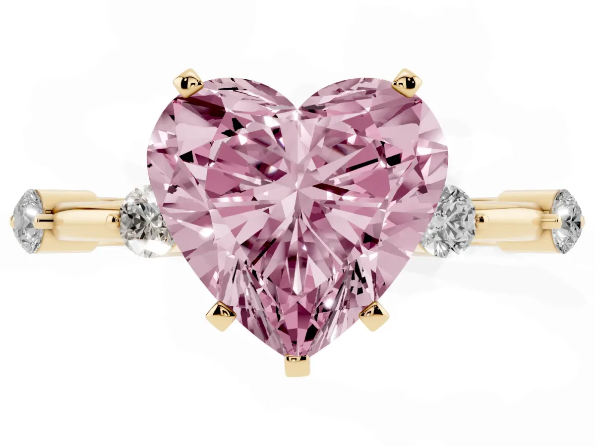 Fancy Pink Heart Cut Solitaire Diamond Ring with Bezel Set Side Stones and Prong Setting Yellow gold