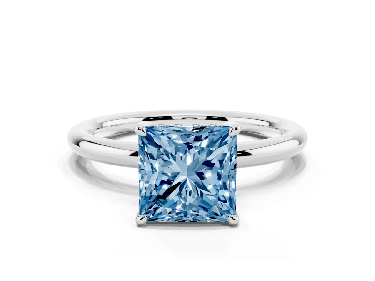 Fancy Blue Princess Cut Diamond Solitaire Ring with Thin Band and Four-Prong Setting Platinum