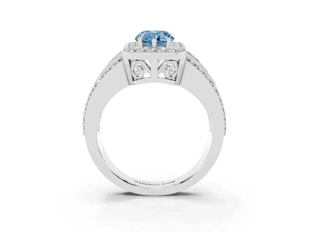 Fancy Blue Pear Cut Halo Diamond Ring with Round Split Shank and Prong Setting Platinum