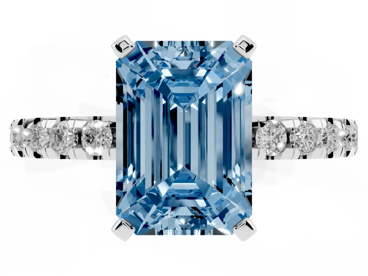 Fancy Blue Emerald Cut Diamond Solitaire Ring with Round Pavé Band and Four-Prong Setting Silver