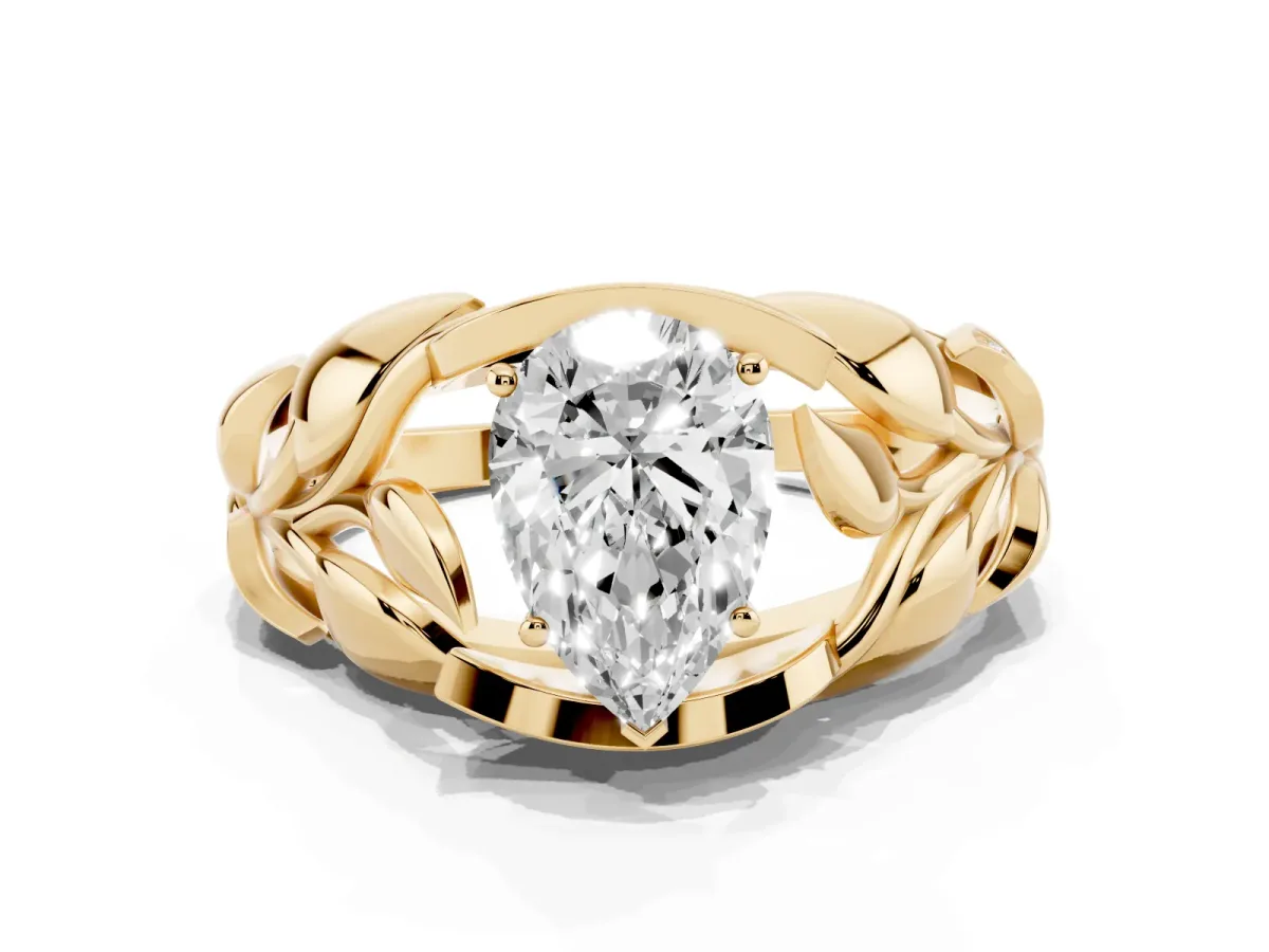 Pear Cut Diamond Leaf-Inspired Engagement Ring with Round Accents and Prong Setting Yellow gold