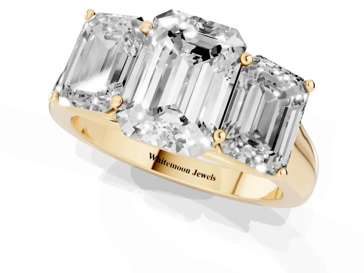 Emerald Cut Three-Stone Diamond Ring with Prong Setting on a Classic Band Yellow gold