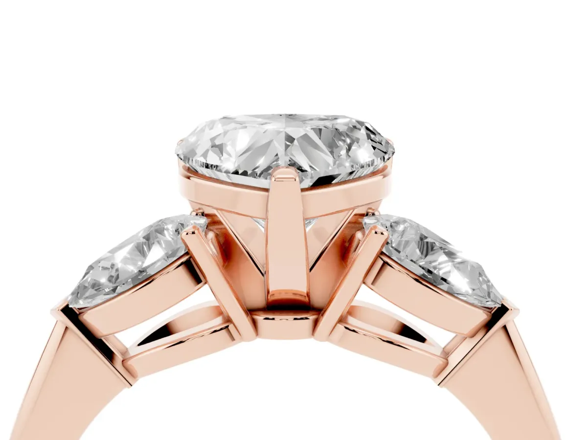 Three-Stone Heart Cut Diamond Ring with Pear Side Stones and Four-Prong Setting Rose gold