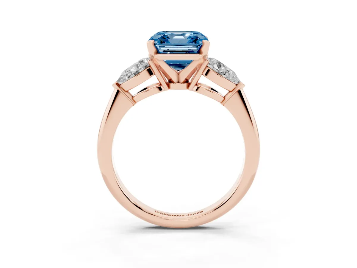 Fancy Blue Three-Stone Asscher Cut Diamond Ring with Pear Side Stones and Four-Prong Setting Rose gold