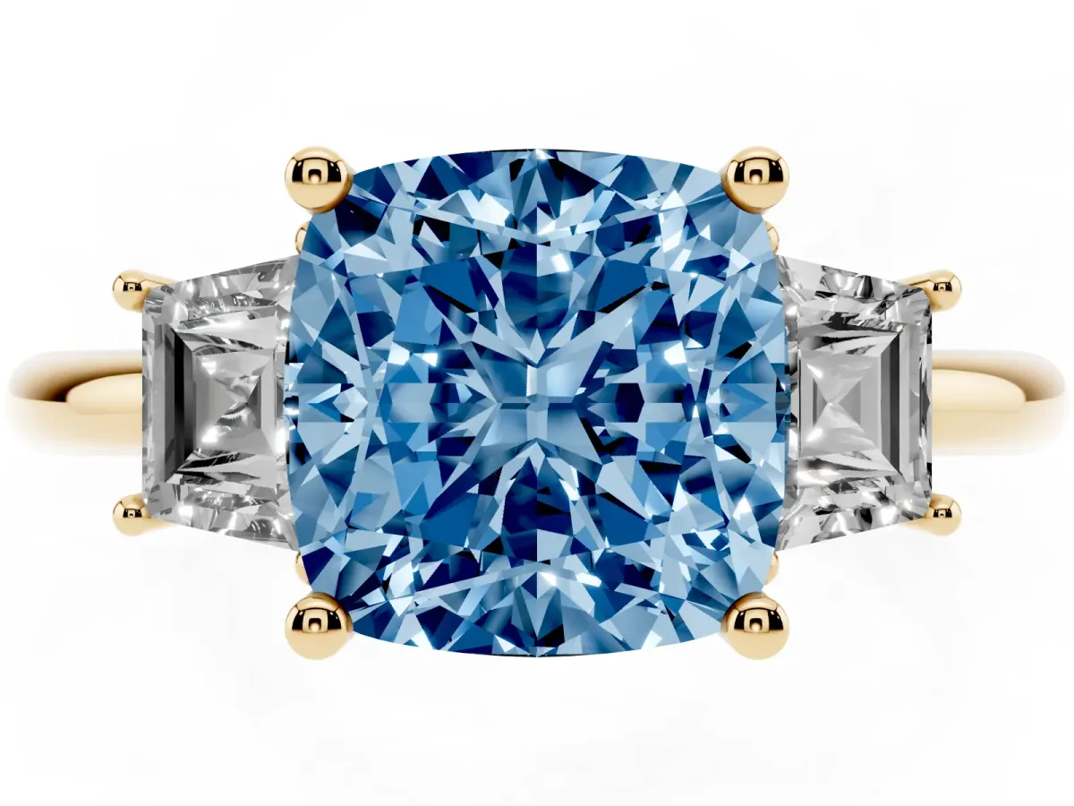 Fancy Blue Cushion Cut Diamond Three-Stone Ring with Trapezoid Side Stones and Prong Setting Yellow gold