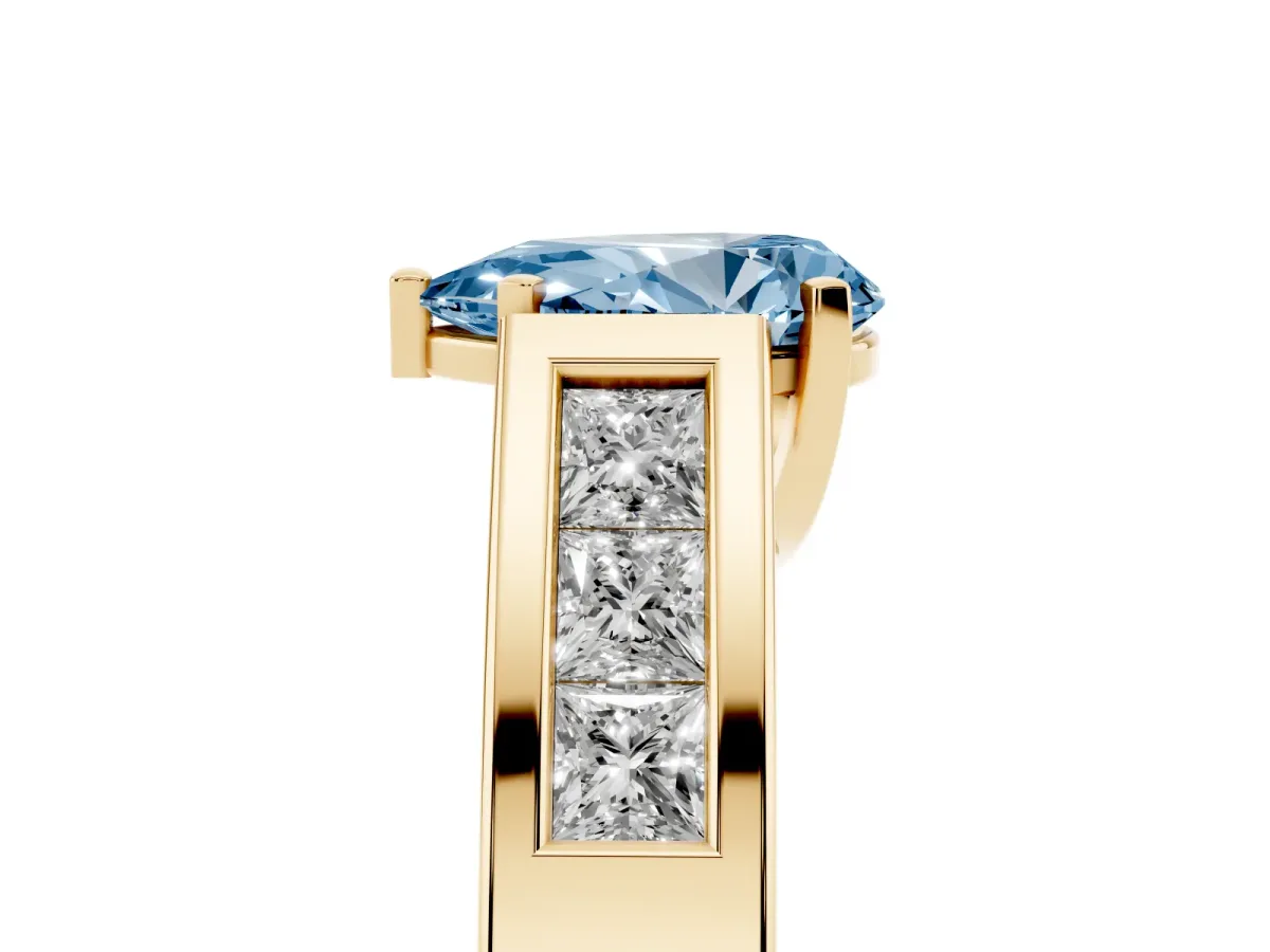 Fancy Blue Pear Cut Cut Channel Set Solitaire Ring with Four-Prong Setting Yellow gold