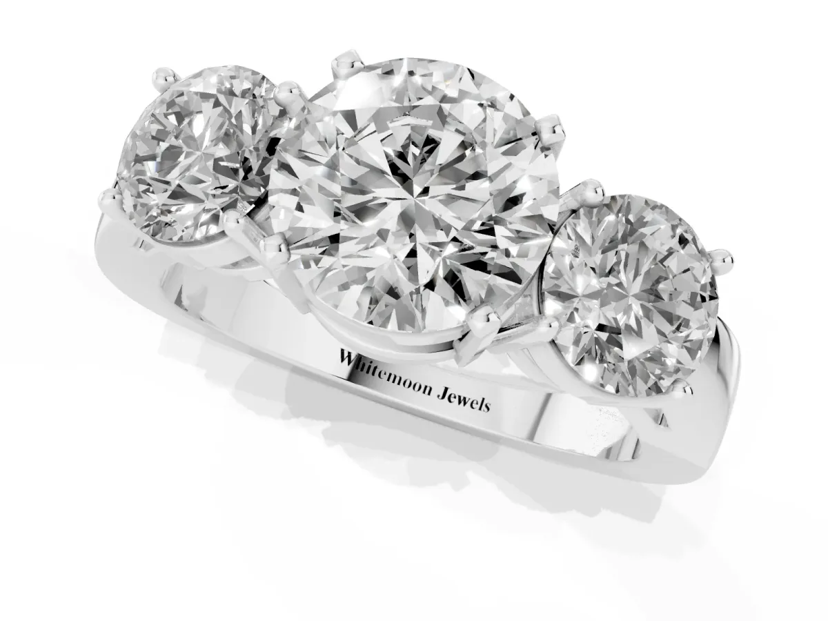 Three-Stone Round Cut Diamond Ring with Round Side Stones, Classic Band, and Four-Prong Setting White gold