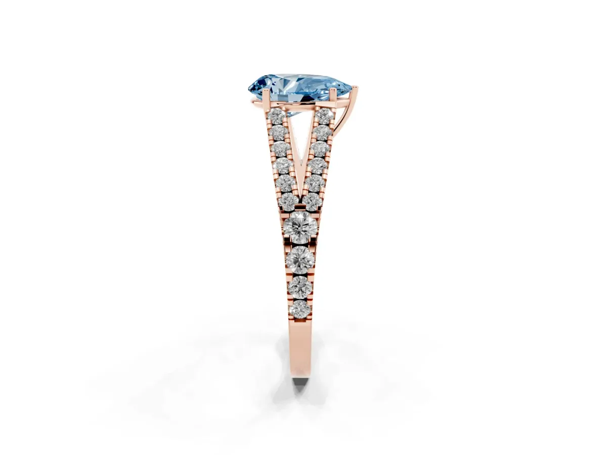 Fancy Blue Pear Cut Diamond Split Shank Engagement Ring with Round Pavé and Prong Setting Rose gold
