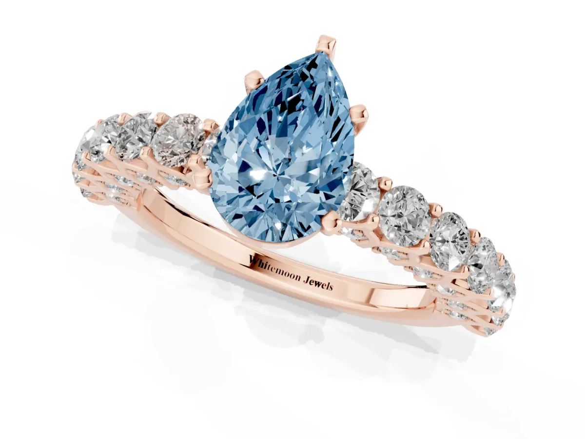 Fancy Blue Pear Cut Diamond Solitaire Ring with Shared Prong Pavé Band and Four-Prong Setting Rose gold