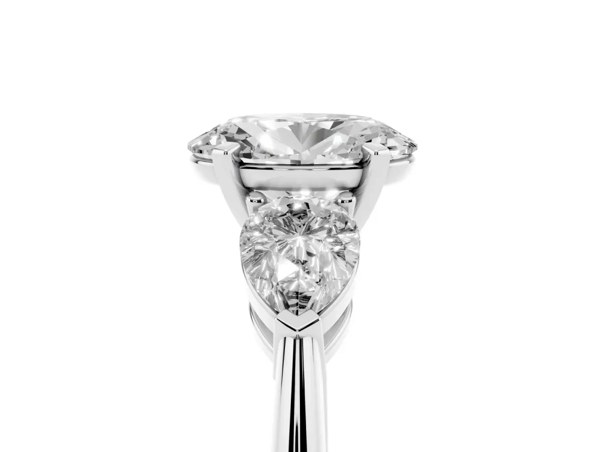 Three-Stone Oval Cut Diamond Ring with Pear Side Stones and Four-Prong Setting White gold