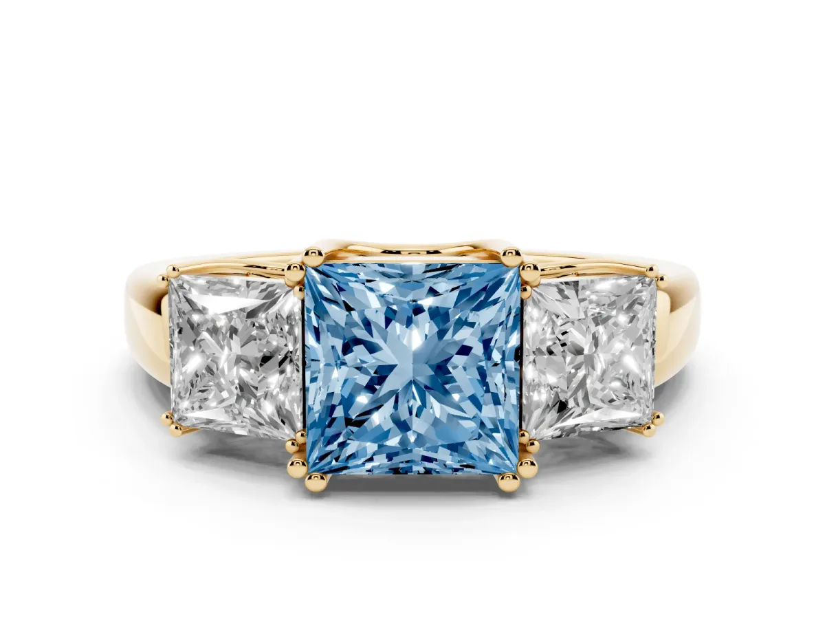 Fancy Blue Three-Stone Princess Cut Cut Diamond Ring with Channel Set Band and Four-Prong Setting Yellow gold