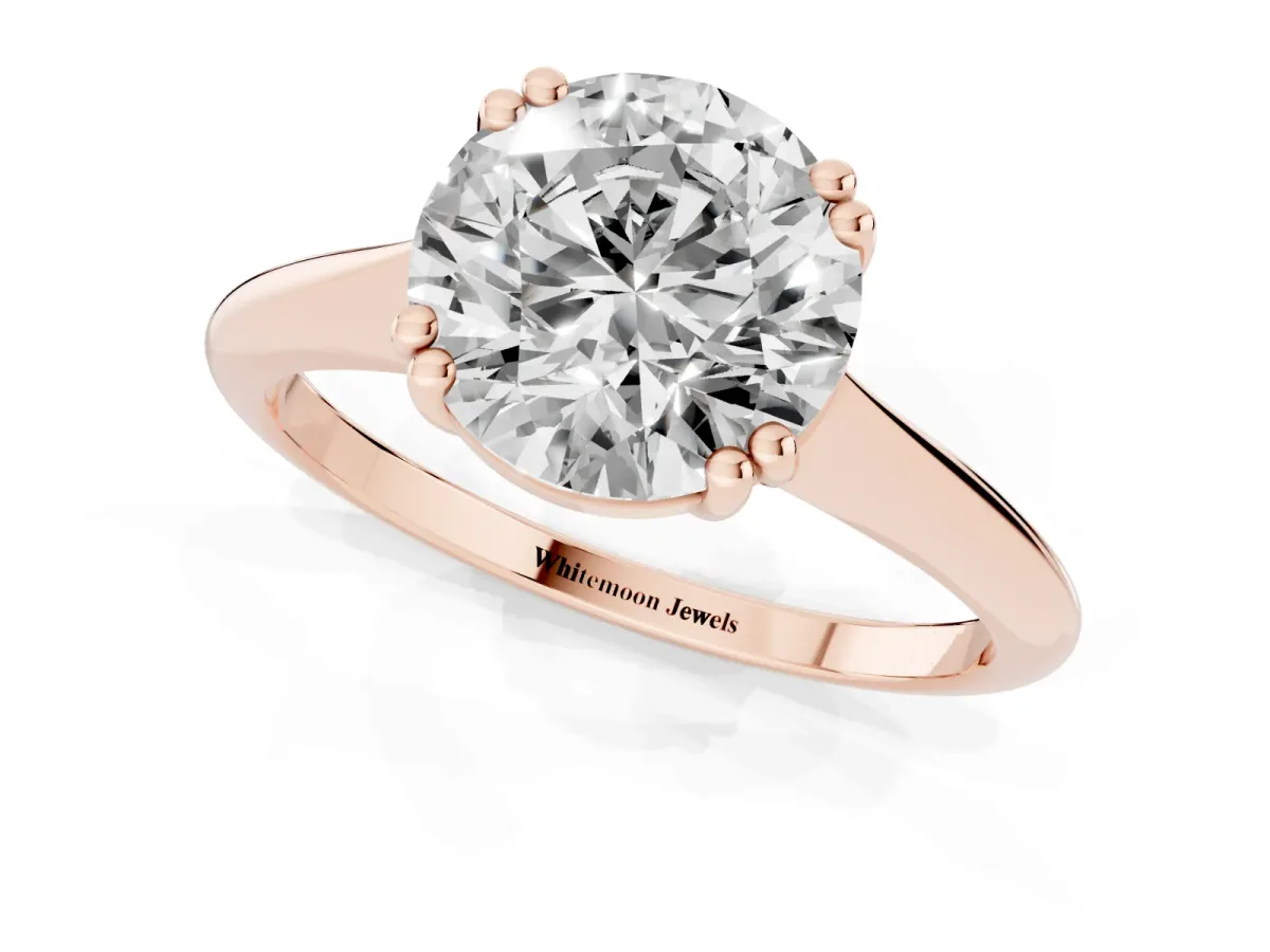 Round Cut Solitaire Diamond Ring with Six-Prong Setting and Classic Band Rose gold