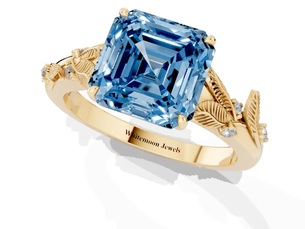 Fancy Blue Asscher Cut Diamond Solitaire Ring with Leaf Motif Band and Four-Prong Setting Yellow gold
