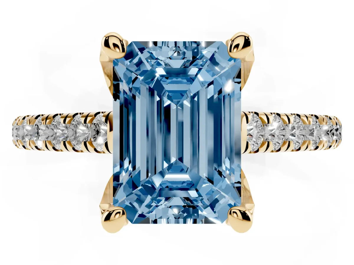 Fancy Blue Emerald Cut Brilliant Diamond Solitaire with Pavé Band and Four-Prong Setting Yellow gold